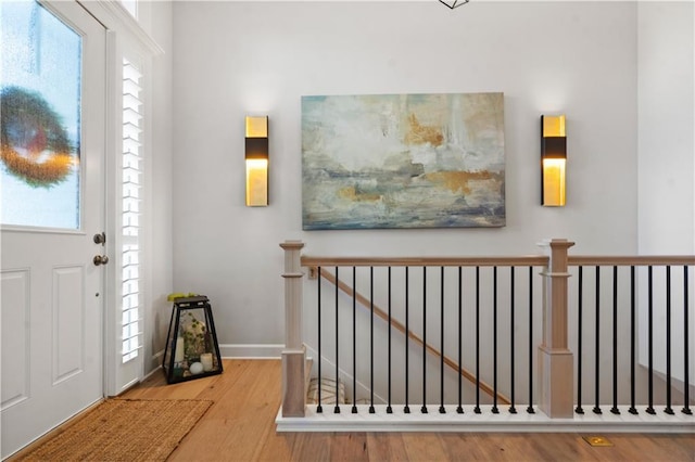 13389 W 147th Ter, Olathe, KS 66062 - foyer entrance featuring wood finished floors and plenty of natural light