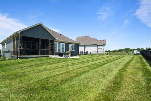 13389 W 147th Ter, Olathe, KS 66062 - back of property with a sunroom and a fenced backyard