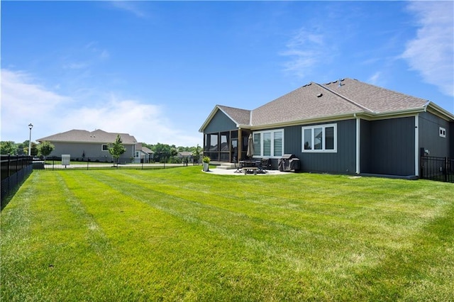 13389 W 147th Ter, Olathe, KS 66062 - back of house featuring a fenced backyard, a patio area, a sunroom, and roof with shingles