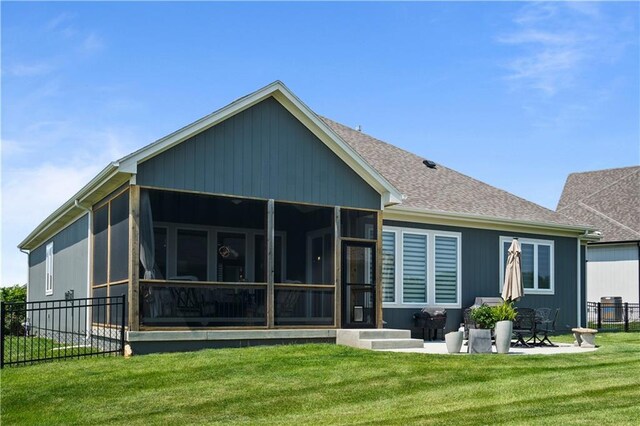 13389 W 147th Ter, Olathe, KS 66062 - back of property with a sunroom and a shingled roof