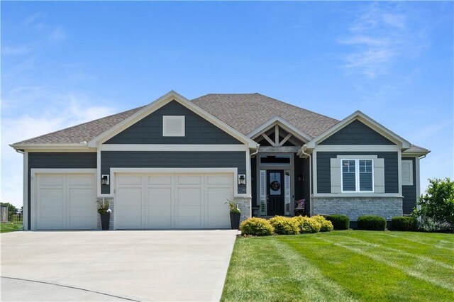13389 W 147th Ter, Olathe, KS 66062 - craftsman-style home featuring an attached garage, driveway, brick siding, and a front yard