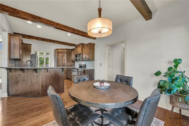 2301 NE 110th St, Kansas City, MO 64155 - dining space featuring beamed ceiling, wood finished floors, and recessed lighting