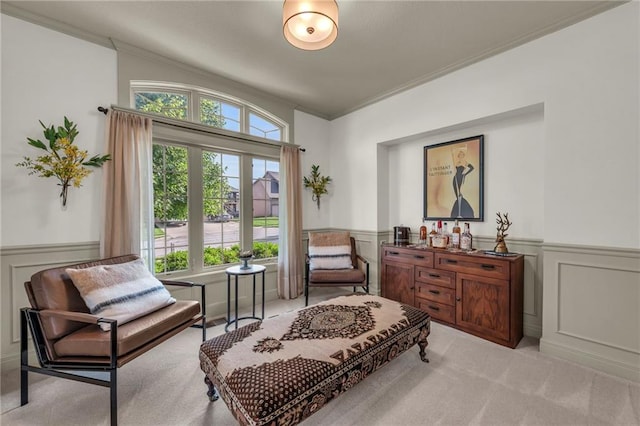 2301 NE 110th St, Kansas City, MO 64155 - living area featuring a decorative wall, wainscoting, light colored carpet, and crown molding
