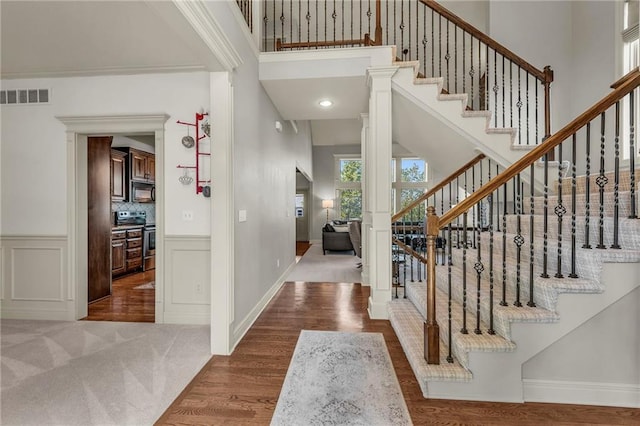 2301 NE 110th St, Kansas City, MO 64155 - foyer with a towering ceiling, stairs, and wood finished floors