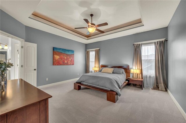 2301 NE 110th St, Kansas City, MO 64155 - carpeted bedroom with a raised ceiling and a ceiling fan
