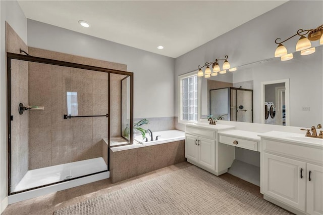 2301 NE 110th St, Kansas City, MO 64155 - full bathroom with a shower stall, washing machine and dryer, double vanity, and a bath