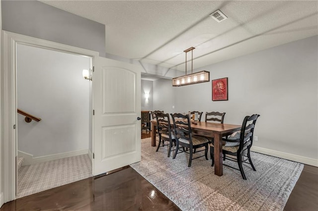 2301 NE 110th St, Kansas City, MO 64155 - dining space featuring baseboards and a textured ceiling