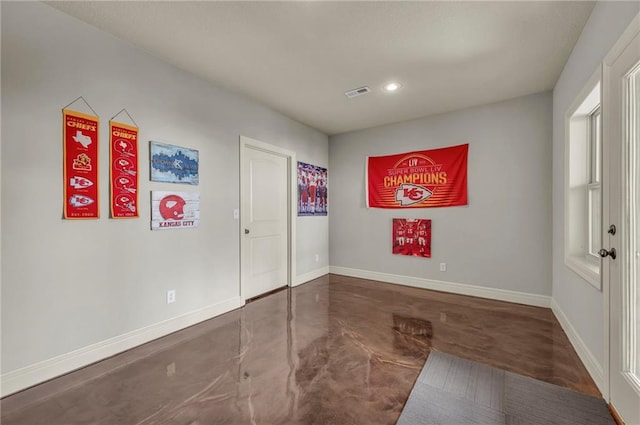 2301 NE 110th St, Kansas City, MO 64155 - foyer entrance with finished concrete flooring and recessed lighting
