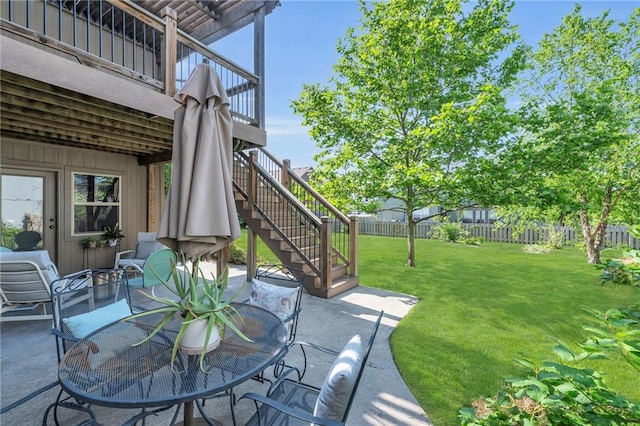 2301 NE 110th St, Kansas City, MO 64155 - fenced backyard featuring stairs, a patio area, a wooden deck, and outdoor dining area