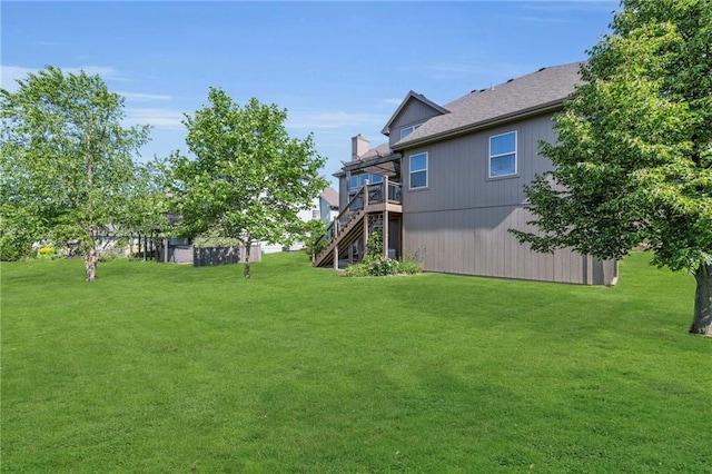 2301 NE 110th St, Kansas City, MO 64155 - view of grassy yard featuring stairs and a deck
