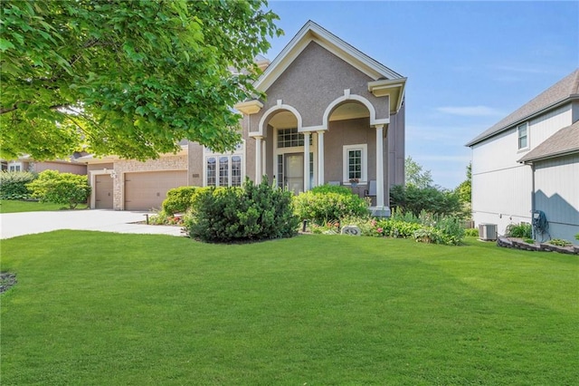 2301 NE 110th St, Kansas City, MO 64155 - view of front of home with a front lawn, driveway, and a garage