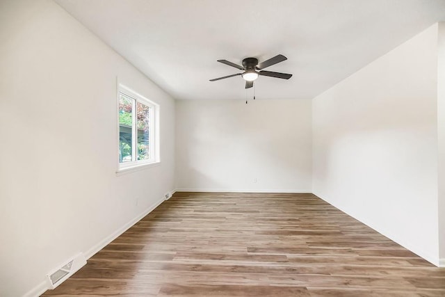 9599 Outlook Dr, Overland Park, KS 66207 - empty room featuring ceiling fan, wood finished floors, and baseboards