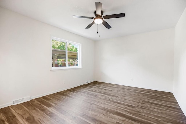 9599 Outlook Dr, Overland Park, KS 66207 - unfurnished room featuring wood finished floors, baseboards, and ceiling fan