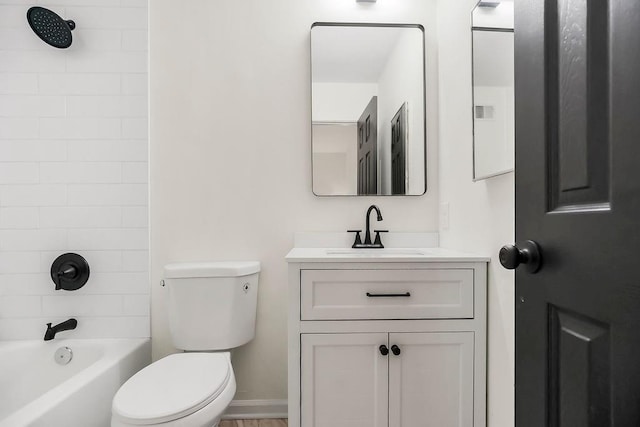 9599 Outlook Dr, Overland Park, KS 66207 - bathroom featuring toilet, vanity, and bathing tub / shower combination