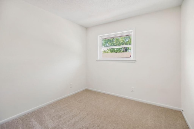 9599 Outlook Dr, Overland Park, KS 66207 - empty room featuring light colored carpet and baseboards