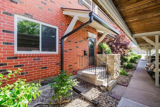 9599 Outlook Dr, Overland Park, KS 66207 - view of exterior entry featuring brick siding