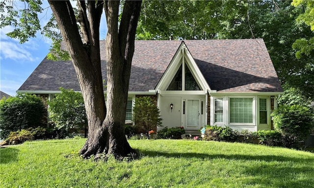 12509 W 100th Ter, Lenexa, KS 66215 - view of front facade featuring a front lawn, a chimney, and a shingled roof
