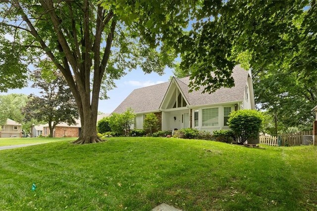 12509 W 100th Ter, Lenexa, KS 66215 - tudor home with roof with shingles
