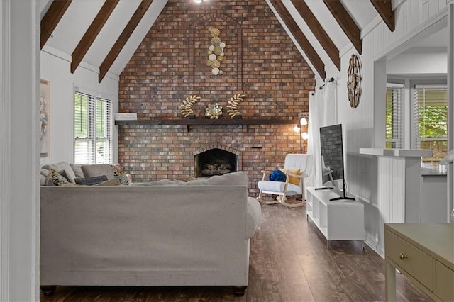 12509 W 100th Ter, Lenexa, KS 66215 - living room featuring a brick fireplace, dark wood-style flooring, beam ceiling, brick wall, and high vaulted ceiling