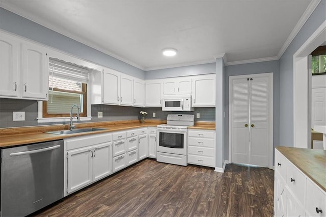 12509 W 100th Ter, Lenexa, KS 66215 - kitchen featuring white appliances, plenty of natural light, white cabinets, crown molding, and decorative backsplash