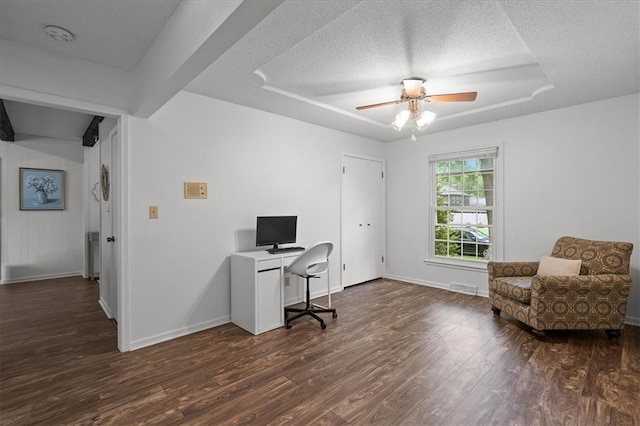 12509 W 100th Ter, Lenexa, KS 66215 - home office with a textured ceiling, dark wood finished floors, a ceiling fan, and a raised ceiling