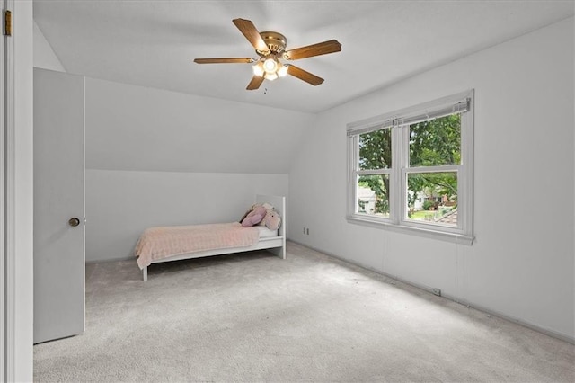 12509 W 100th Ter, Lenexa, KS 66215 - bedroom with carpet flooring, vaulted ceiling, and ceiling fan