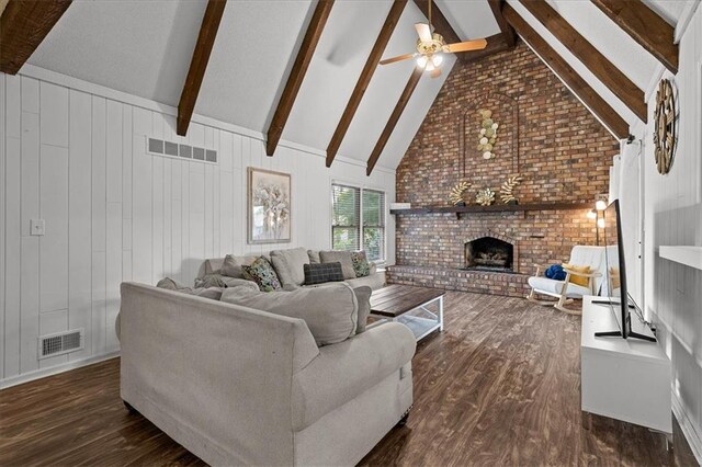 12509 W 100th Ter, Lenexa, KS 66215 - living room featuring beam ceiling, wood finished floors, a brick fireplace, a ceiling fan, and high vaulted ceiling
