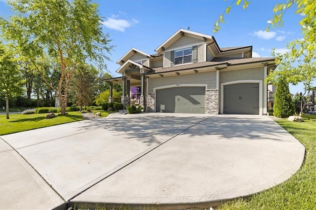 15945 W 165th St, Olathe, KS 66062 - craftsman inspired home with concrete driveway, stone siding, a front yard, and a garage