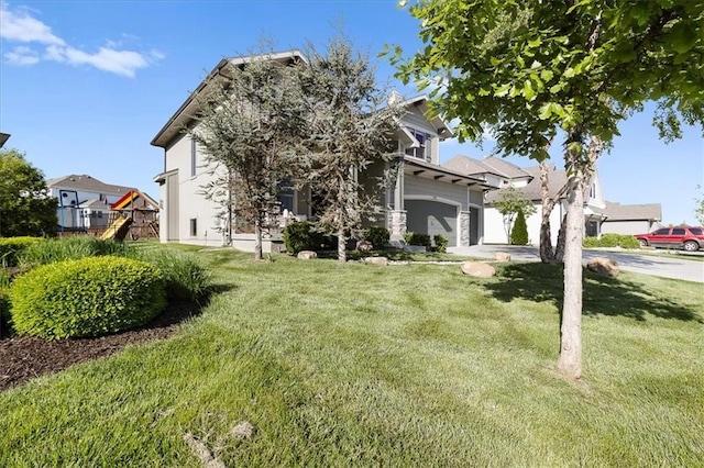 15945 W 165th St, Olathe, KS 66062 - view of property hidden behind natural elements featuring a garage and a front yard