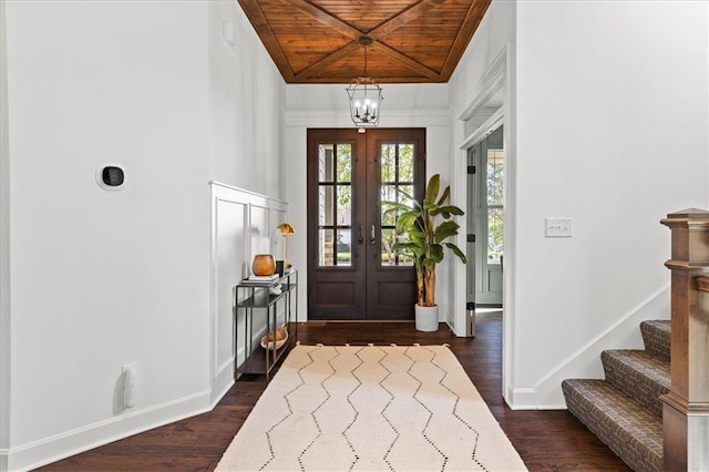 15945 W 165th St, Olathe, KS 66062 - foyer featuring wooden ceiling, dark wood finished floors, a chandelier, baseboards, and stairs
