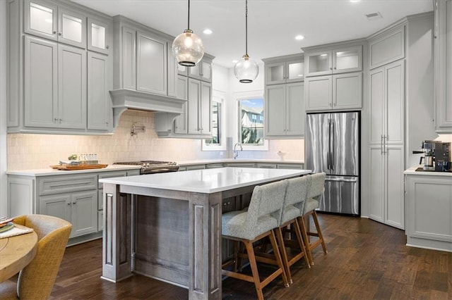 15945 W 165th St, Olathe, KS 66062 - kitchen with freestanding refrigerator, light countertops, dark wood-style floors, gray cabinets, and recessed lighting