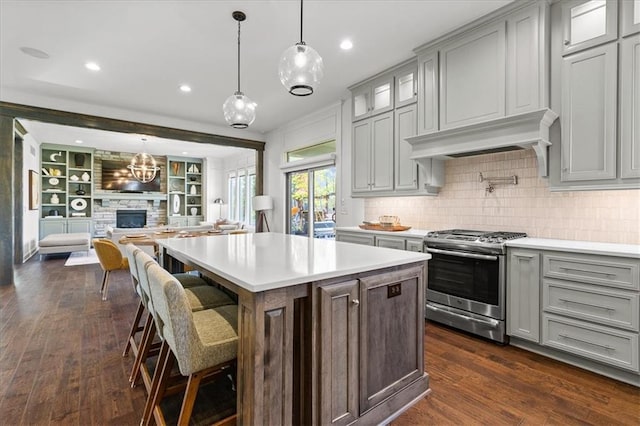15945 W 165th St, Olathe, KS 66062 - kitchen featuring stainless steel gas range oven, gray cabinetry, light countertops, decorative backsplash, and recessed lighting