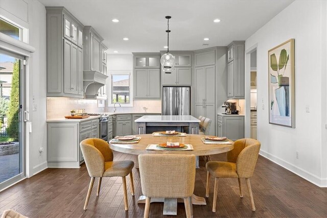 15945 W 165th St, Olathe, KS 66062 - dining room featuring baseboards, dark wood-style floors, and recessed lighting