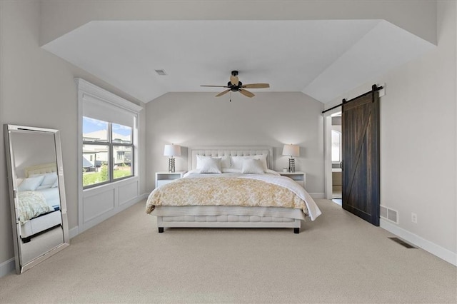 15945 W 165th St, Olathe, KS 66062 - carpeted bedroom featuring vaulted ceiling, a barn door, baseboards, and a ceiling fan