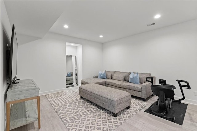 15945 W 165th St, Olathe, KS 66062 - living area featuring light wood-style floors, baseboards, and recessed lighting