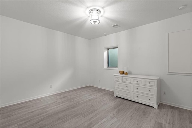 15945 W 165th St, Olathe, KS 66062 - spare room featuring light wood-style flooring and baseboards