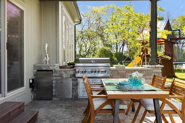 15945 W 165th St, Olathe, KS 66062 - view of patio with outdoor dining area and a playground