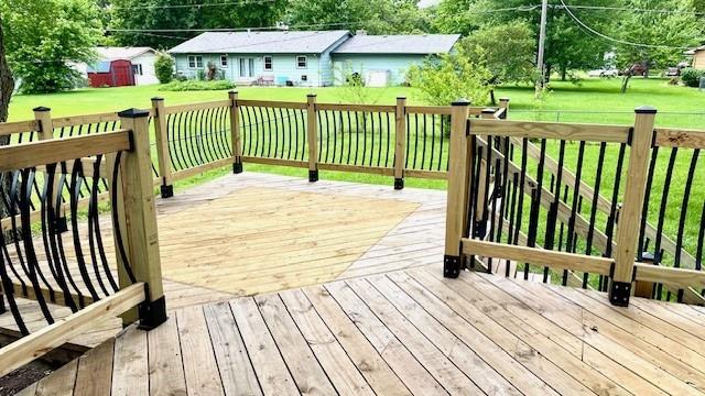 1636 S Poplar St, Ottawa, KS 66067 - wooden terrace featuring a yard