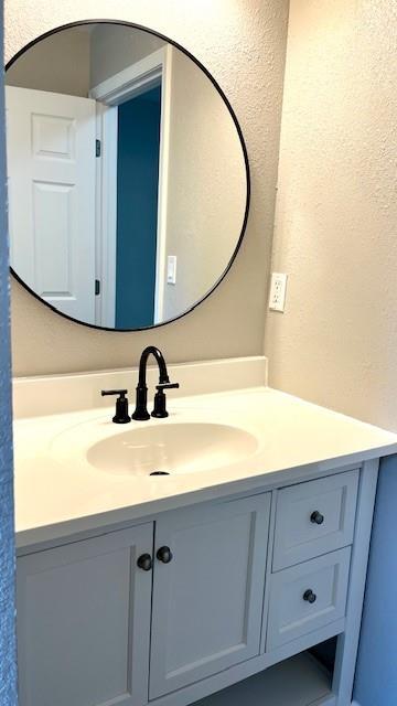 1636 S Poplar St, Ottawa, KS 66067 - bathroom with vanity and a textured wall