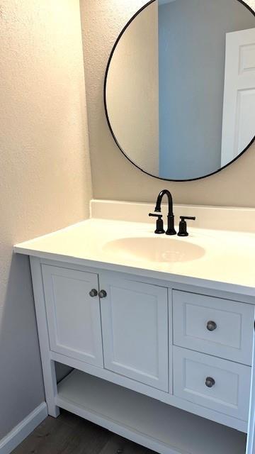 1636 S Poplar St, Ottawa, KS 66067 - bathroom with vanity and baseboards