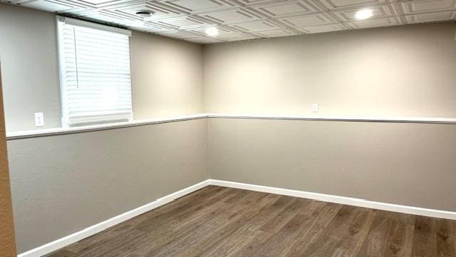 1636 S Poplar St, Ottawa, KS 66067 - spare room featuring baseboards, wood finished floors, and an ornate ceiling