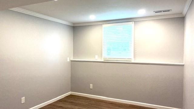 1636 S Poplar St, Ottawa, KS 66067 - empty room featuring crown molding, dark wood-style floors, baseboards, and recessed lighting