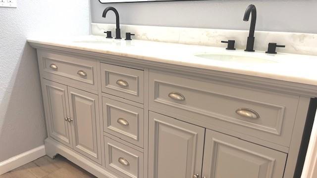1636 S Poplar St, Ottawa, KS 66067 - bathroom with double vanity and baseboards
