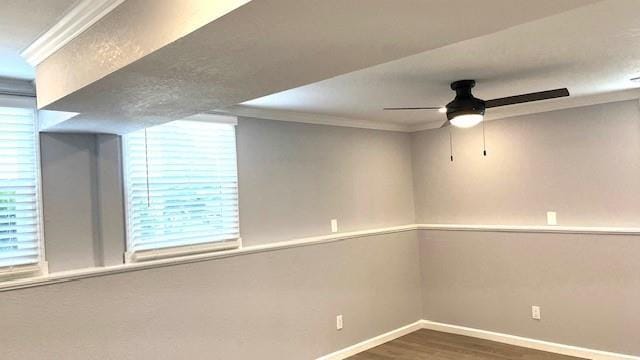 1636 S Poplar St, Ottawa, KS 66067 - spare room featuring ornamental molding, wood finished floors, a ceiling fan, and baseboards