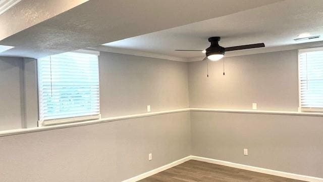 1636 S Poplar St, Ottawa, KS 66067 - empty room with baseboards, wood finished floors, ceiling fan, and ornamental molding