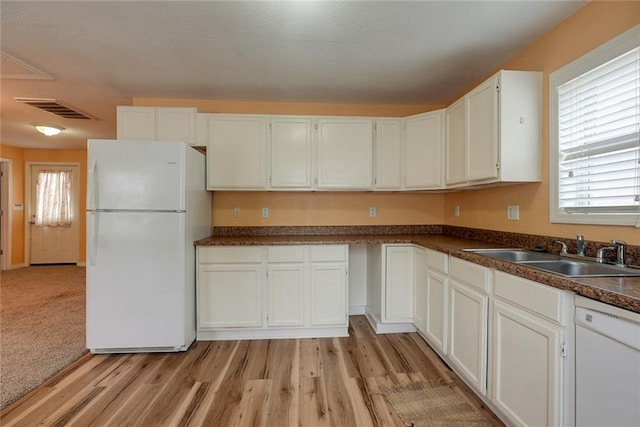 814 E Hayward Ave, Independence, MO 64050 - kitchen with white appliances, a sink, dark countertops, and white cabinets