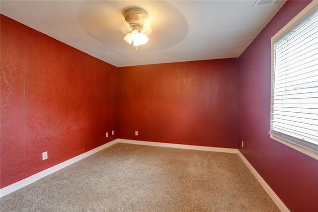 814 E Hayward Ave, Independence, MO 64050 - unfurnished room featuring a ceiling fan, carpet floors, and baseboards
