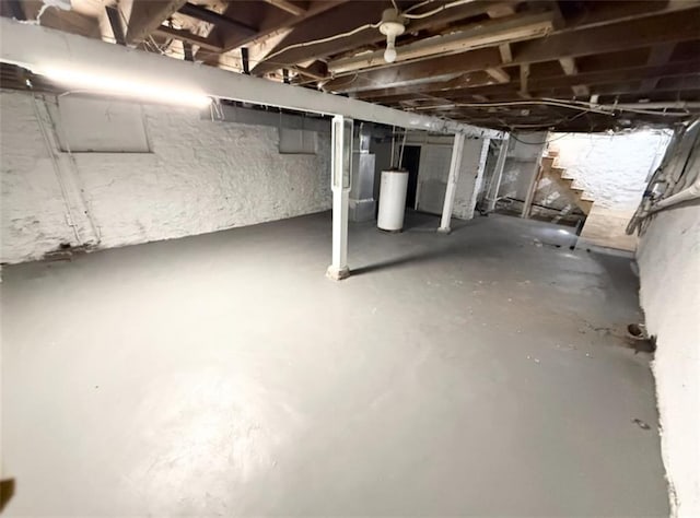 7216 Indiana Ave, Kansas City, MO 64132 - unfinished basement with water heater