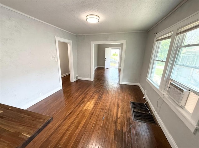7216 Indiana Ave, Kansas City, MO 64132 - unfurnished room with a textured ceiling, wood-type flooring, ornamental molding, and baseboards