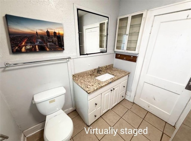 7216 Indiana Ave, Kansas City, MO 64132 - bathroom featuring vanity, toilet, and tile patterned floors